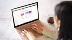business woman typing on a laptop